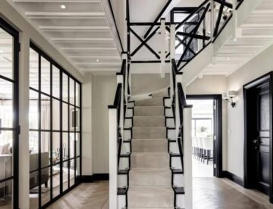 Redecorated hallway and staircase with black framed glazing