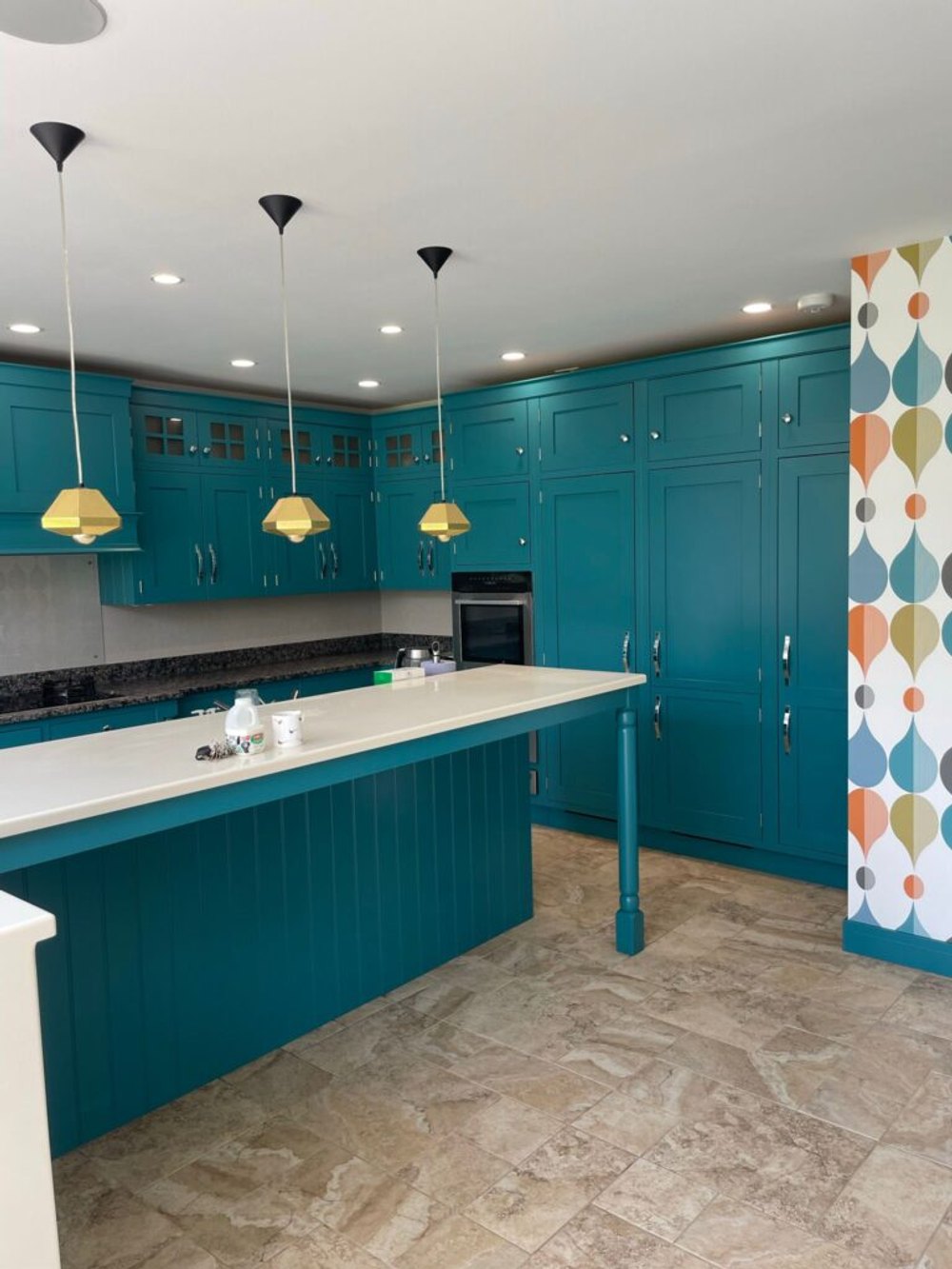 Kitchen units hand-painted in teal